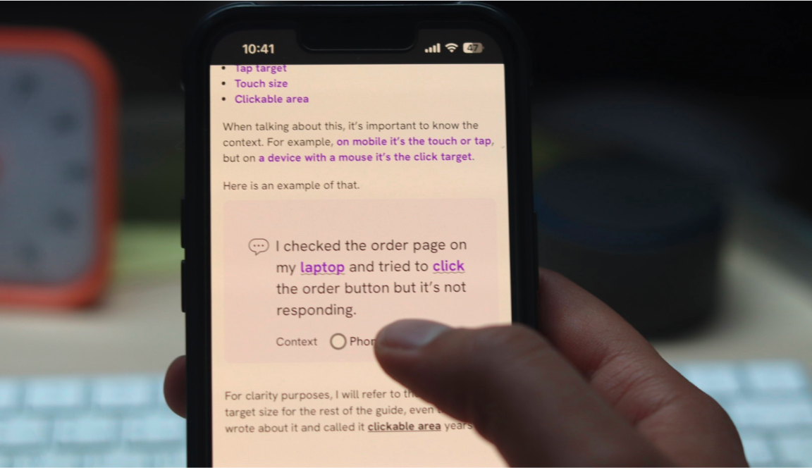 User holding a mobile and try to select from a list of options positioned under the main content.